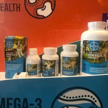Various Bayer Omega-3 fish oil supplements for pets displayed.
