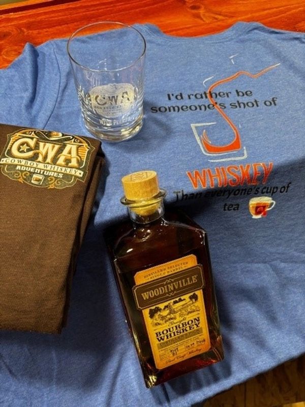 Woodinville Whiskey Company's Bourbon whiskey with Cowboy Whiskey Adventures merchandise. 