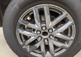 Paint Peeling on a 2019 GMC Acadia damaged wheel at Light House Buick in Morton IL. 