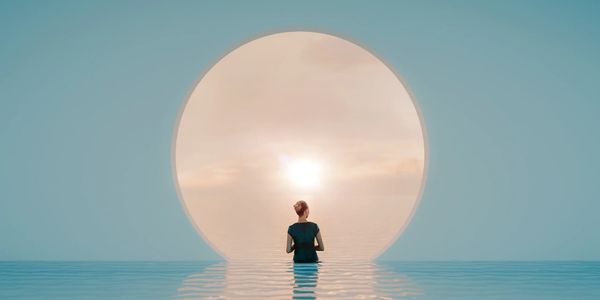 Woman stands in water before glowing portal at sunrise — a soulful beginning into the unknown.