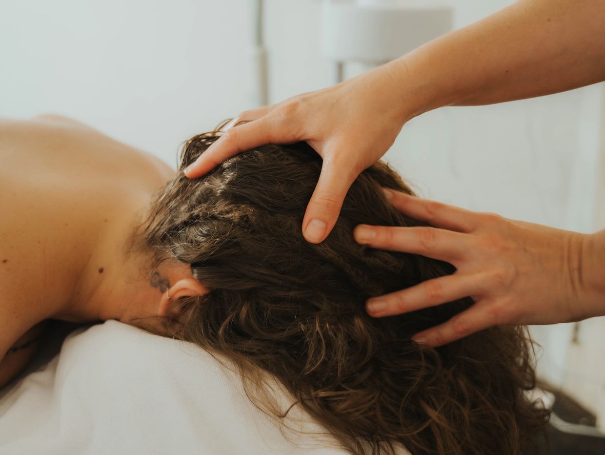 Person receiving a relaxing scalp massage.