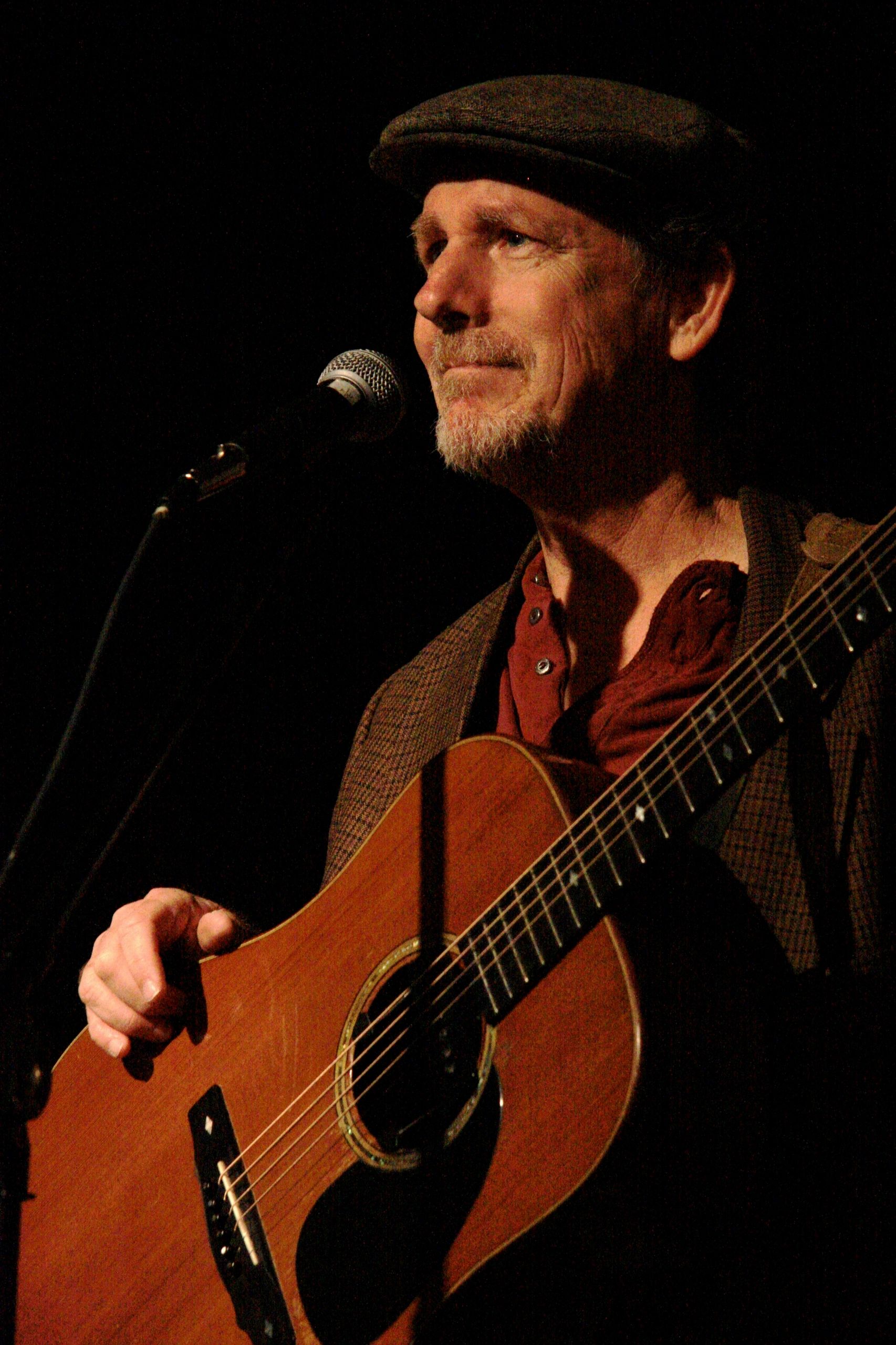 Severin on stage with guitar