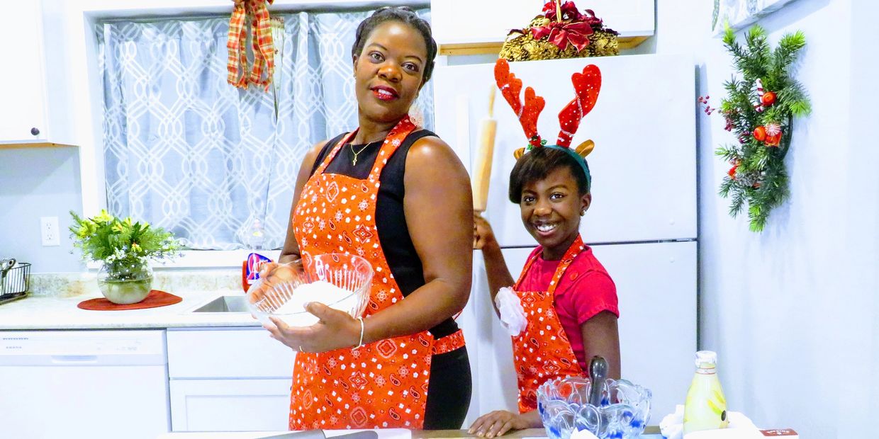 Mother and daughter making food in the kitchen