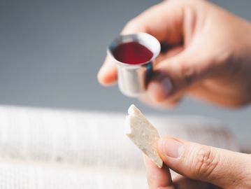 Person taking communion. 