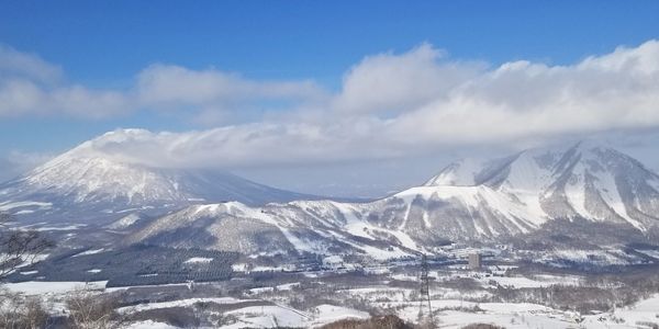 Rusutsu mountain range with Mount Yotei in the background ルスツスキー場の山　羊蹄山が後ろに見えます　冬　雪　パウダースノー