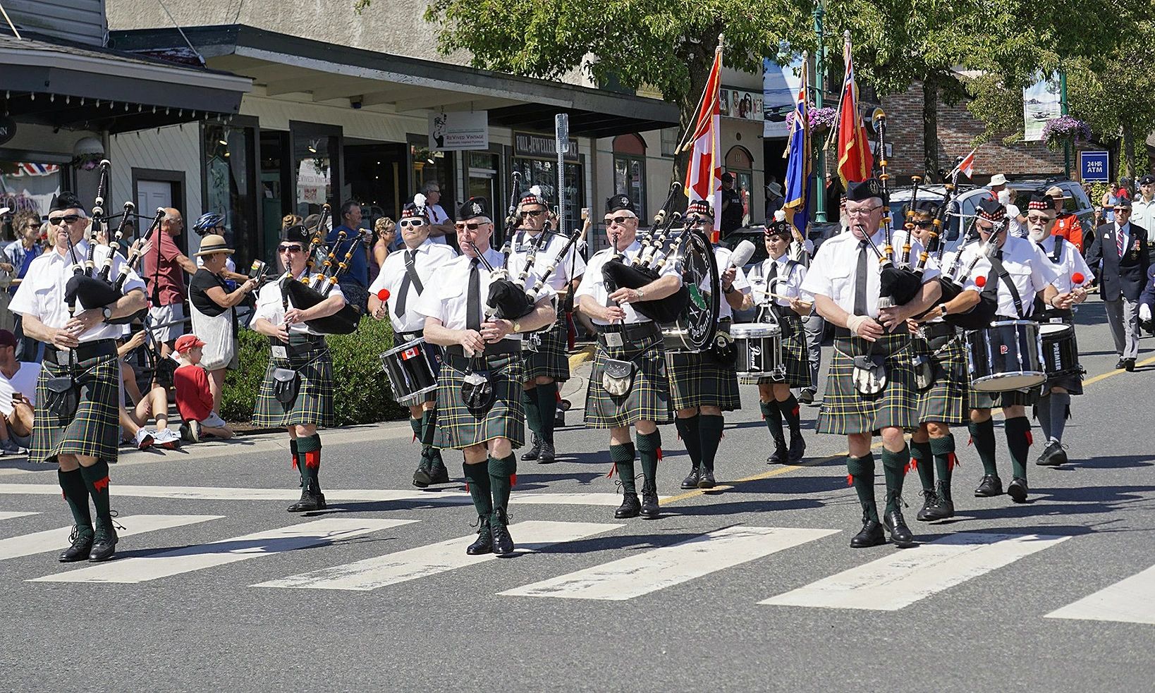   
O Canada 2019: The Qualicum Beach Pipe Band leading the Canada Day Parade to the Qualicum Beach C