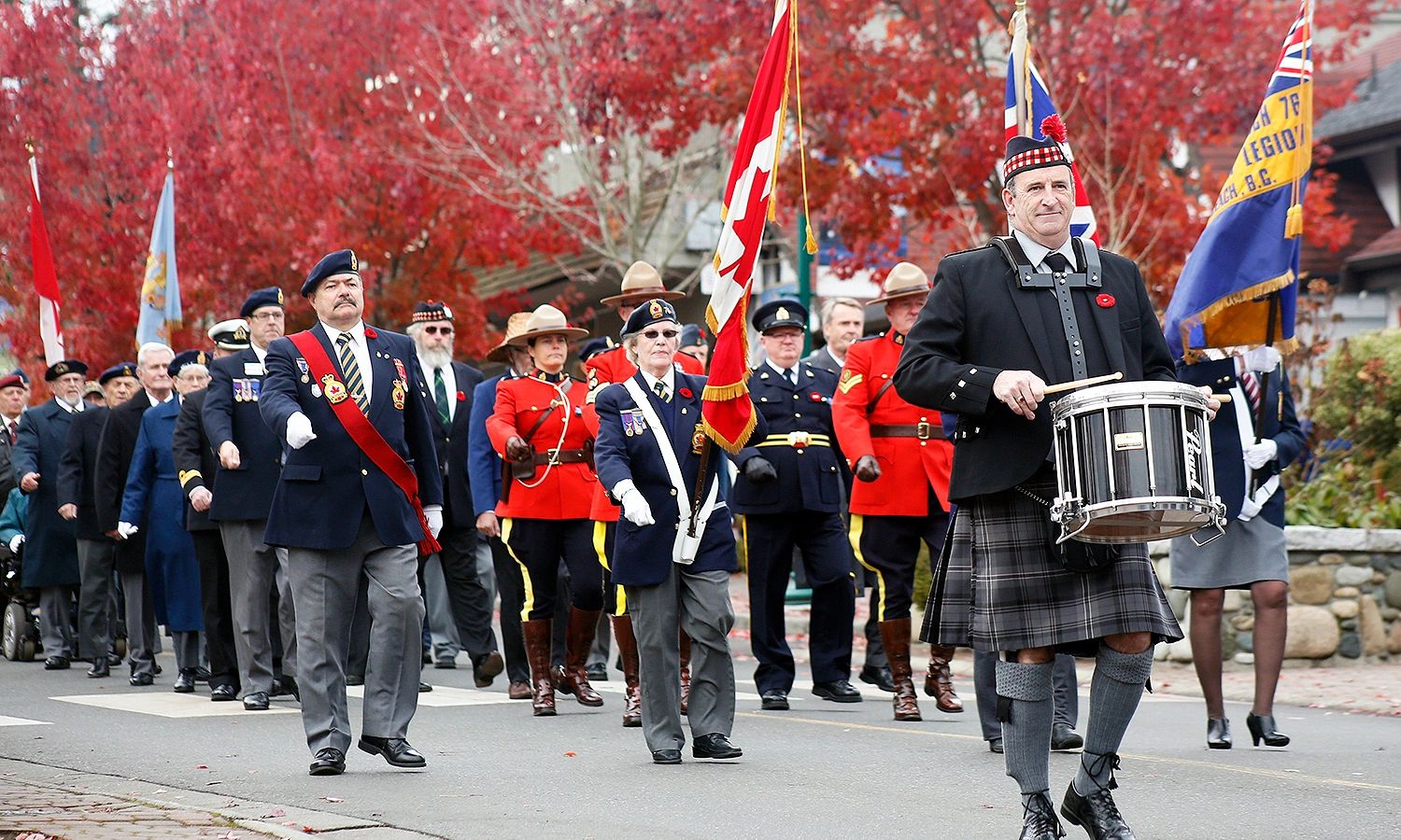 REMEMBRANCE DAY 2017: Cliff Reynolds drums with the Qualicum Beach Pipe Band during the parade to th