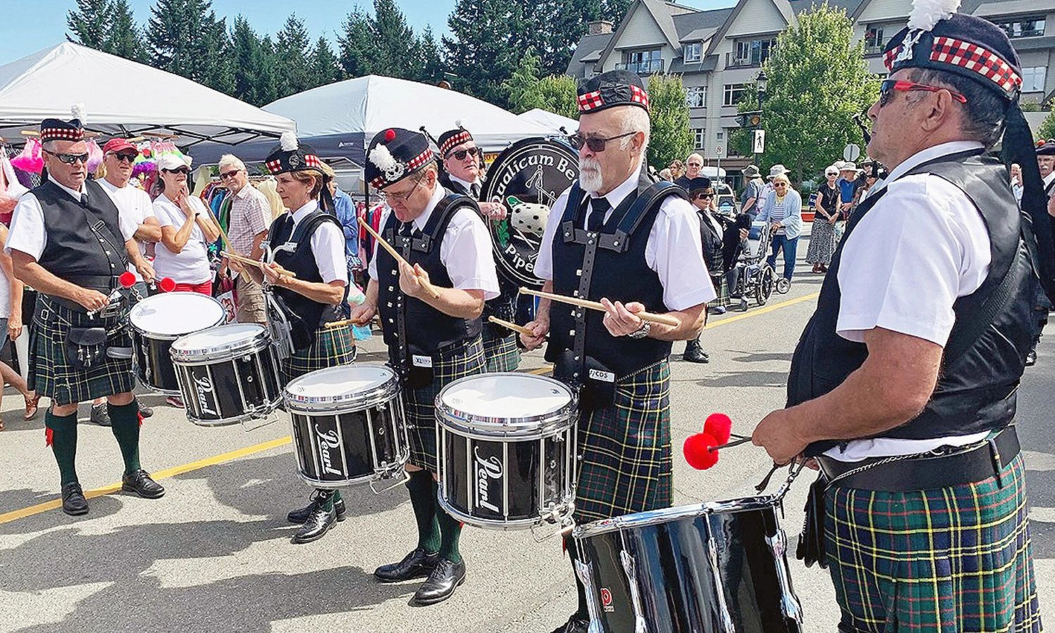July 2019: Members of the Qualicum Beach Pipe Band drum corps perform at the annual St. Mark’s Fair.