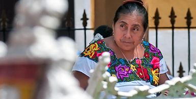 A Maya woman sitting on a bench in Valladolid, Yucatan.