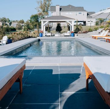 A resort style swimming pool installed in a customers back yard