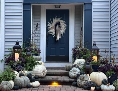 Blue, white, and neutral pumpkin porch decor, with mixed annual color pots and lanterns in delaware.