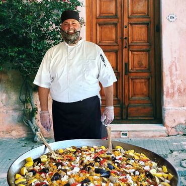 Chef Daniel King Owner of The Paella Party People out of Fort Pierce, Florida. Preparing a Big Pan P