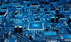 Close-up of a blue circuit board with electronic components.