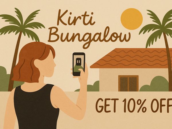 Woman taking photo of Kirti Bungalow with 10% off offer.