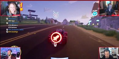 Four gamers playing a racing game online.