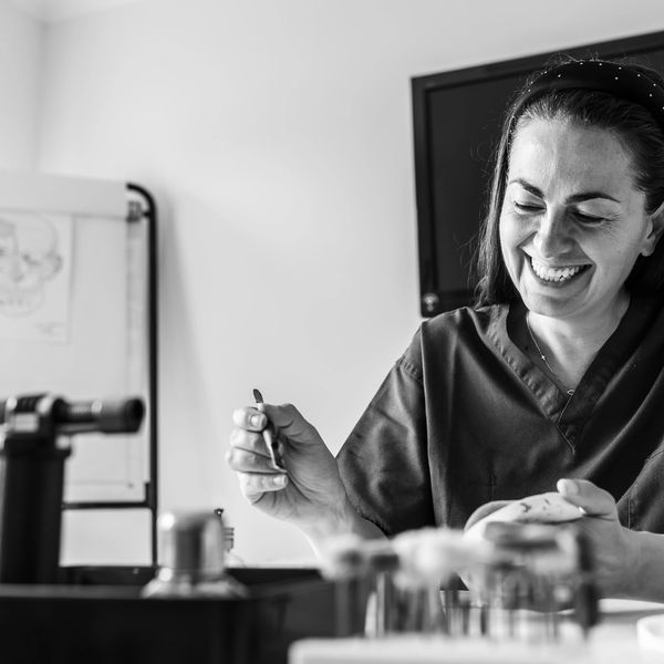 A girl smiling while working