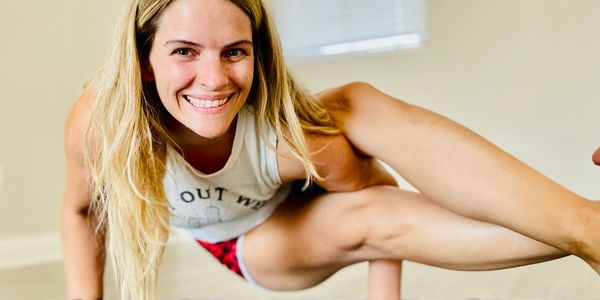 woman in an 8-angle arm balance