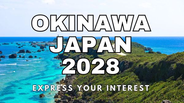 Scenic Okinawa coastline with turquoise waters and green cliffs, promoting Japan 2028.