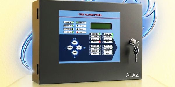Fire alarm panel with status indicators and a key.