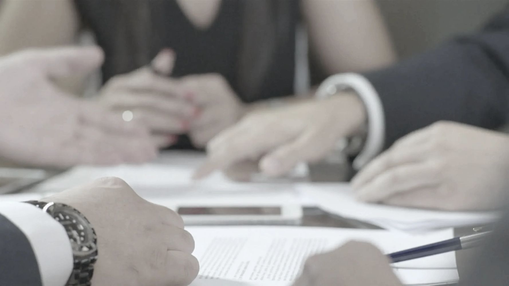 A group of people having a meeting

