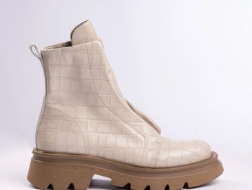 Beige ankle boot with a chunky sole and crocodile texture.