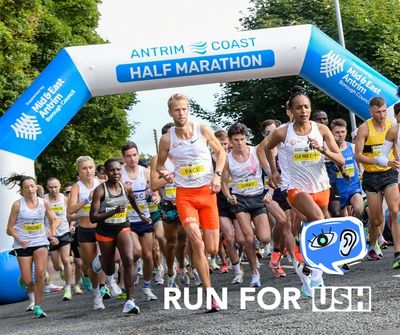 Photo of runners at starting line of the Antrim Coast Half Marathon. Overlaid text “Run for USH" 