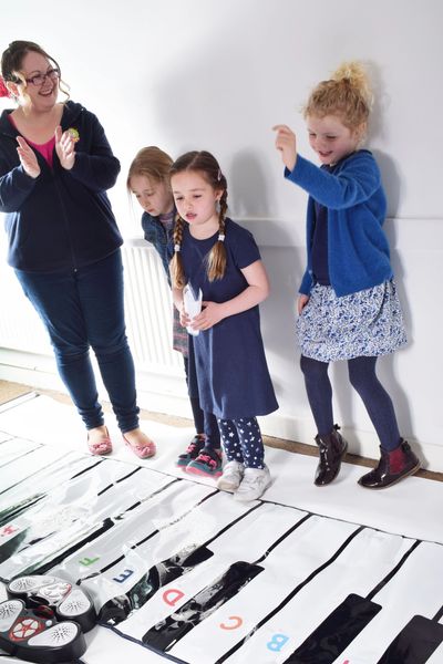 Keybra pupils learning on giant keyboards