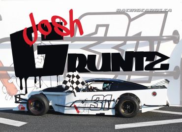 White racecar #31 with driver holding checkered flag, Josh Vruntz name in bold letters.