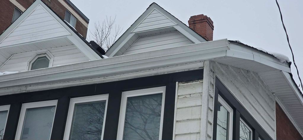 ice dam removal and build up on shingles and trough.