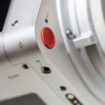 Close-up of a camera's control buttons and ports.