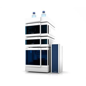 A high-tech laboratory instrument with multiple stacked modules and two bottles on top.