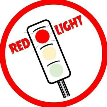 Illustration of a traffic light with the red light highlighted and text "RED LIGHT."
