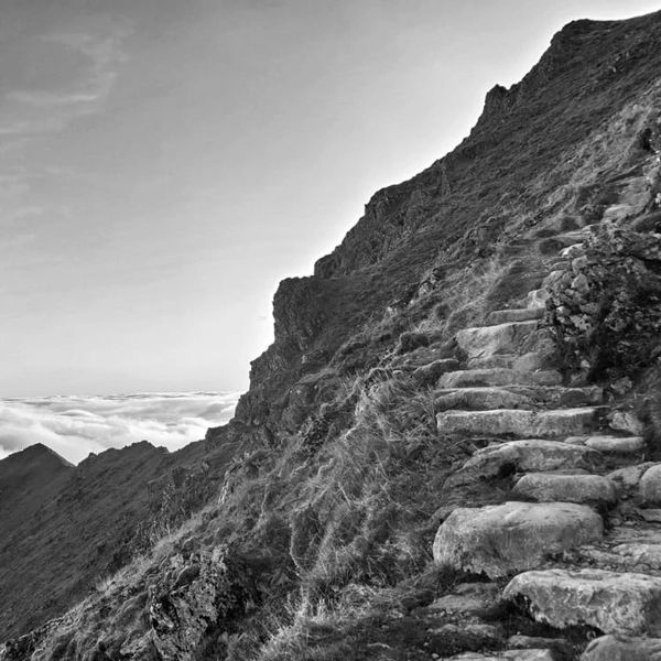 Stone steps on a steep mountain slope.