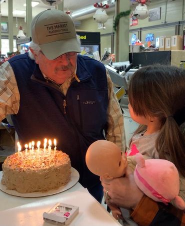 Randy celebrating his birthday with his grand-daughter and the staff of The Market. Happy Birthday!