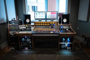 Recording studio control room with an API 1608 analog console and studio desk. The studio mix room.