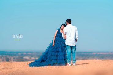 Couple sharing a tender moment outdoors on a clear day.