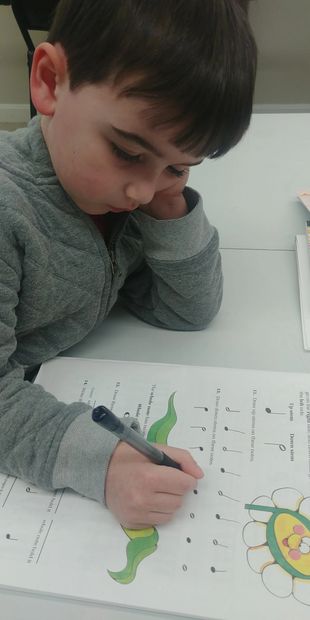 a young boy does his homework