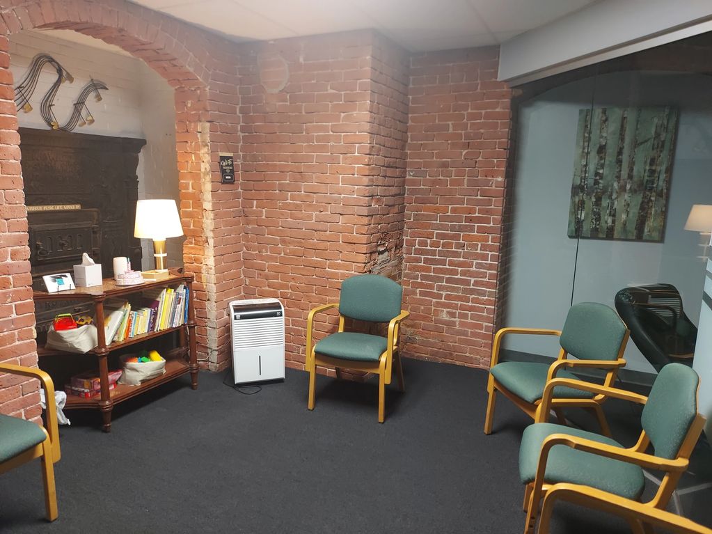 Room with brick walls and chairs