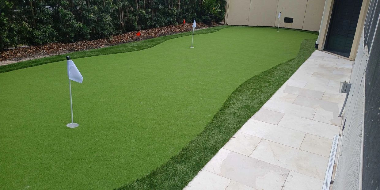 Custom artificial golf turf installed in a backyard putting green, offering a smooth, pro-level surf