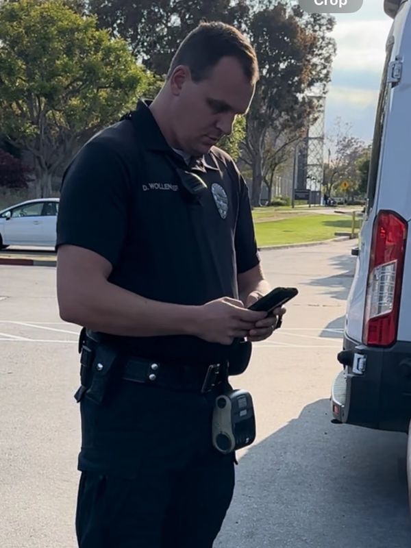 Officer D. Wollenberg rolled up and wrote a ticket without saying a word.