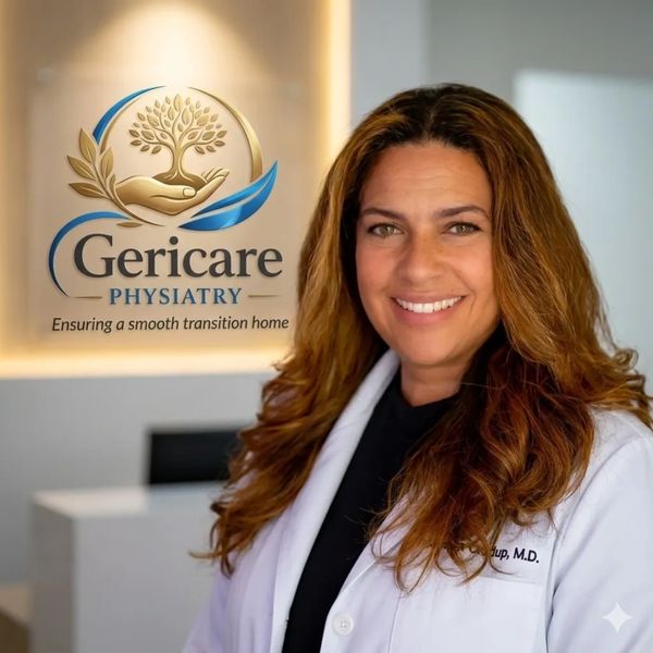 Samara Crudup, M.D. in her medical office with her logo behind her.  Gericare Physiatry.
