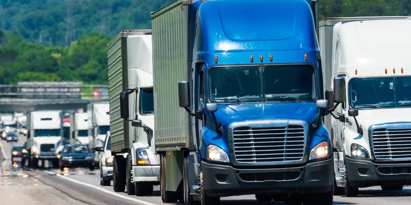 Group of trucks on interstate highway
