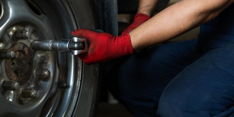Man changing commercial tire