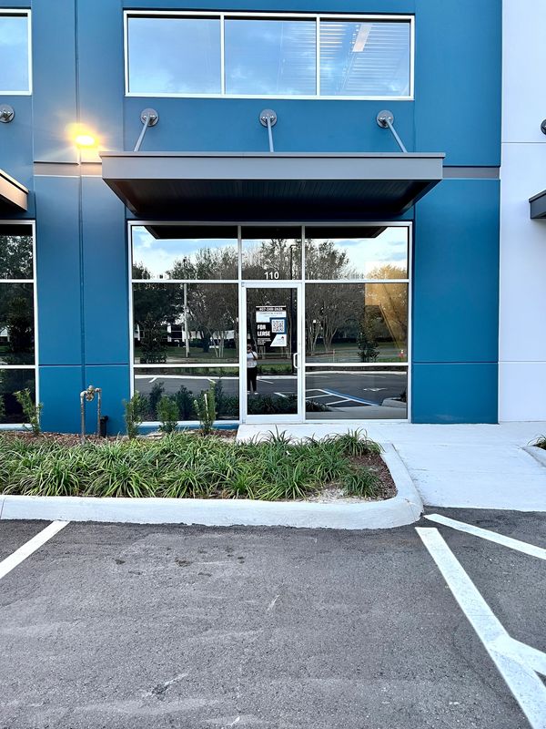 Empty commercial space for lease with blue exterior.