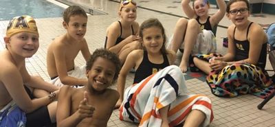 Our swimmers at buckhead aquatics swim team in atlanta are having fun at a swim meet.