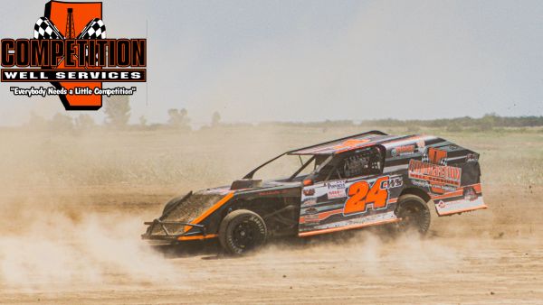 Dirt track racing car with number 24 kicking up dust.