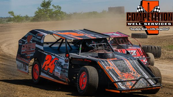 Two modified race cars competing on a dirt track.