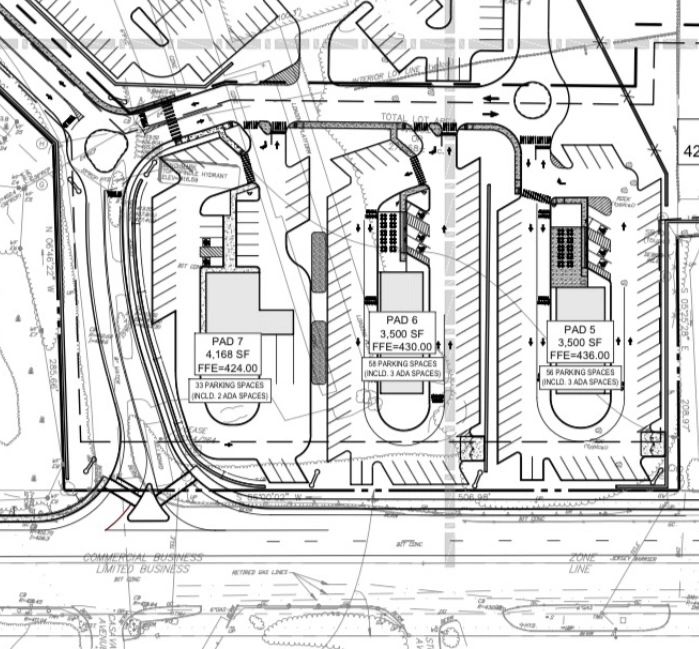 Site plan showing three building pads with parking spaces.