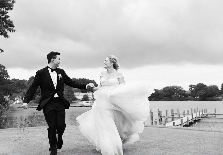 Photo by Paige Elizabeth Photography
Bride and groom running on waterfront 