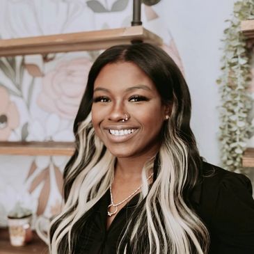 Cosmetologist and esthetician, Bella, smiling